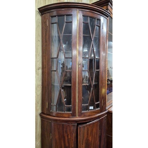 342 - 19th century Mahogany bow front corner cabinet. Top section having bow glass doors. brass trim and c... 