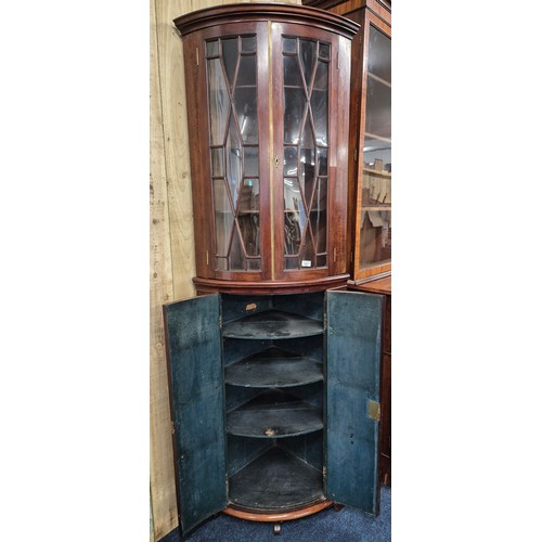 342 - 19th century Mahogany bow front corner cabinet. Top section having bow glass doors. brass trim and c... 