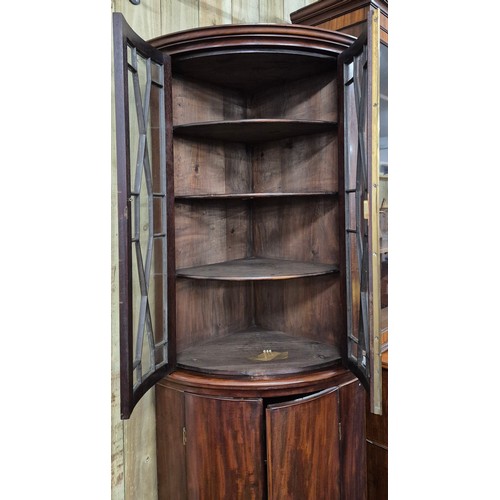 342 - 19th century Mahogany bow front corner cabinet. Top section having bow glass doors. brass trim and c... 