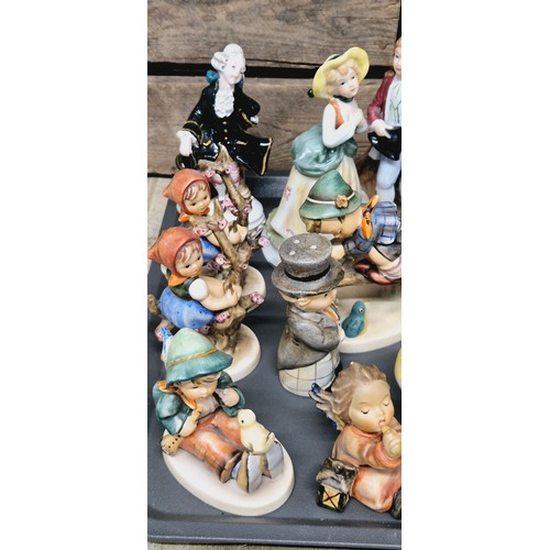 490 - A Tray of collectable German figurines; Hummel figures, German porcelain & others