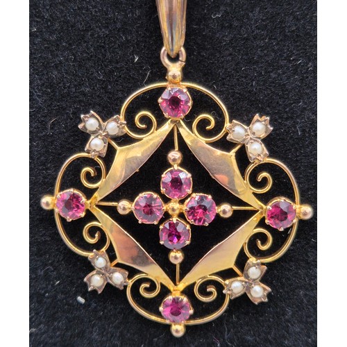 28 - Edwardian 9ct yellow gold, pink stone and seed pearl ornate pendant and 9ct yellow gold necklace. [4... 