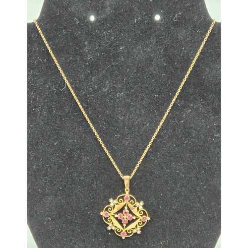 28 - Edwardian 9ct yellow gold, pink stone and seed pearl ornate pendant and 9ct yellow gold necklace. [4... 