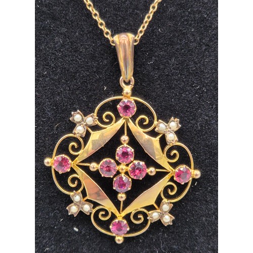 28 - Edwardian 9ct yellow gold, pink stone and seed pearl ornate pendant and 9ct yellow gold necklace. [4... 