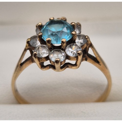 48 - 9ct yellow gold, Aquamarine and white quartz gem stone ring. Large round cut Aquamarine stone surrou... 