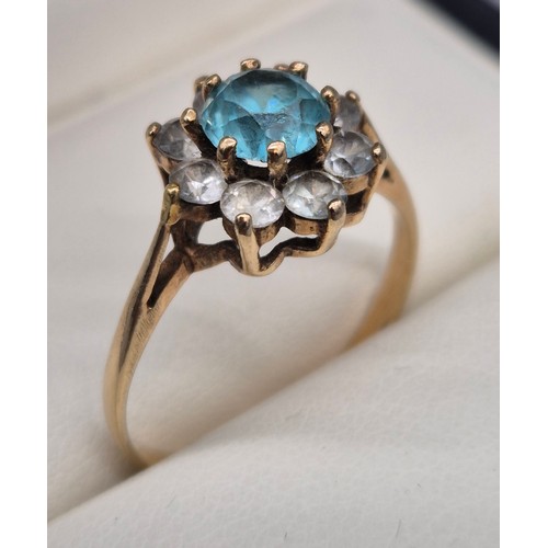 48 - 9ct yellow gold, Aquamarine and white quartz gem stone ring. Large round cut Aquamarine stone surrou... 