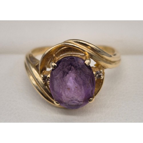 27 - 14ct yellow gold, Amethyst and diamond stone ring. Large oval cut amethyst and two small round cut d... 