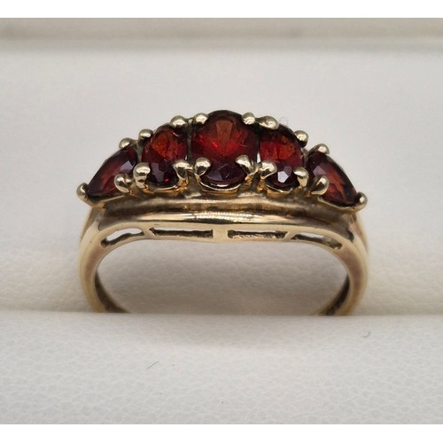 26 - 9ct yellow gold and Garnet stone ring. Three oval cut garnets and two pear cut. [Ring size N] [2.18G... 