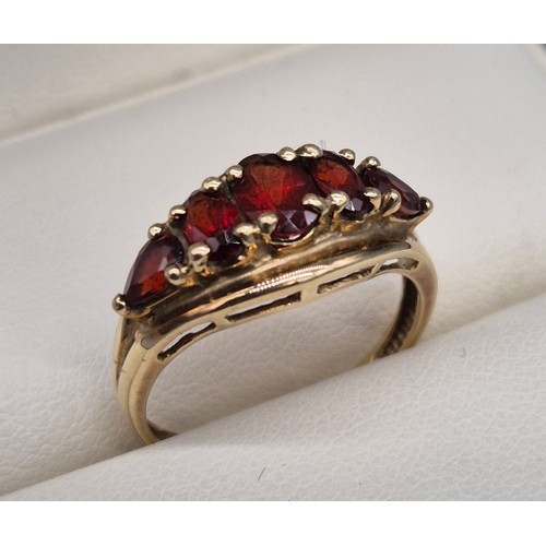 26 - 9ct yellow gold and Garnet stone ring. Three oval cut garnets and two pear cut. [Ring size N] [2.18G... 