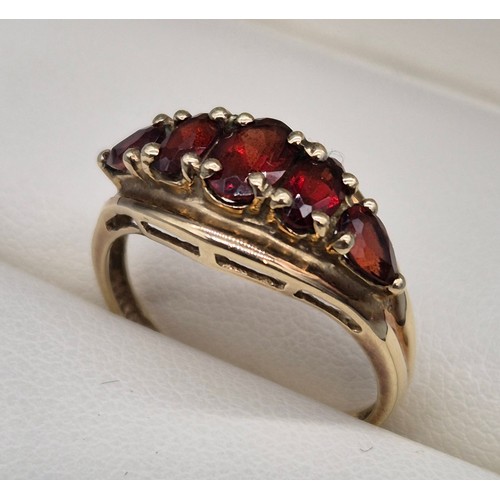 26 - 9ct yellow gold and Garnet stone ring. Three oval cut garnets and two pear cut. [Ring size N] [2.18G... 