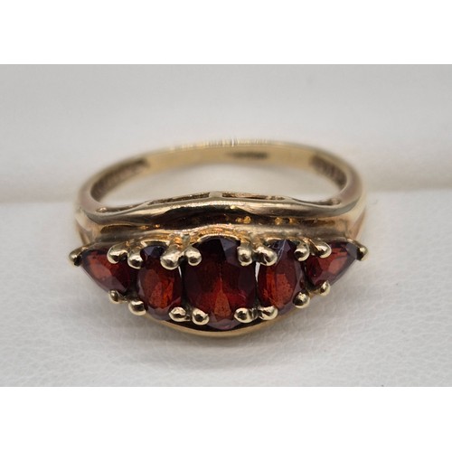 26 - 9ct yellow gold and Garnet stone ring. Three oval cut garnets and two pear cut. [Ring size N] [2.18G... 