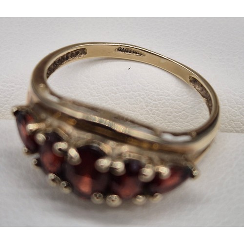 26 - 9ct yellow gold and Garnet stone ring. Three oval cut garnets and two pear cut. [Ring size N] [2.18G... 