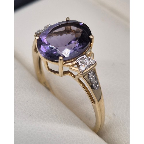 87 - 9ct yellow gold, Amethyst and diamond stone ring. Large oval cut amethyst, round cut diamonds. [Ring... 