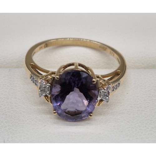 87 - 9ct yellow gold, Amethyst and diamond stone ring. Large oval cut amethyst, round cut diamonds. [Ring... 