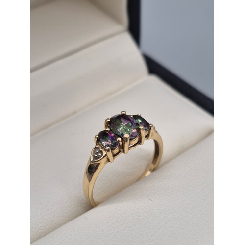 92 - 14ct yellow gold, Alexandrite and diamond gem stone ring. Three Oval cut Alexandrite gem stones and ... 