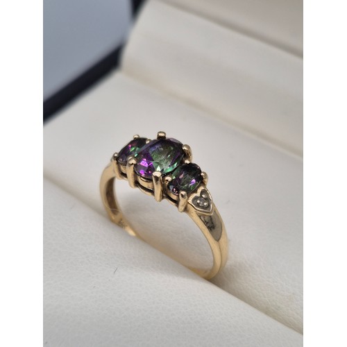 92 - 14ct yellow gold, Alexandrite and diamond gem stone ring. Three Oval cut Alexandrite gem stones and ... 