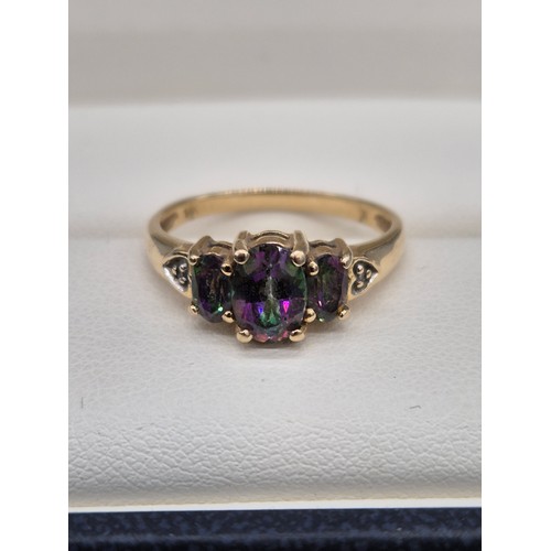 92 - 14ct yellow gold, Alexandrite and diamond gem stone ring. Three Oval cut Alexandrite gem stones and ... 