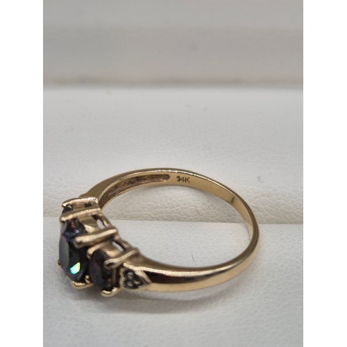 92 - 14ct yellow gold, Alexandrite and diamond gem stone ring. Three Oval cut Alexandrite gem stones and ... 