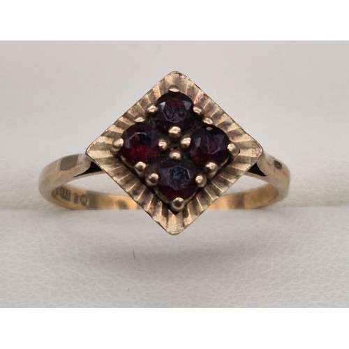 112 - 9ct yellow gold and Garnet stone ring. Four round cut garnets. [Ring size Q] [2.52Grams]