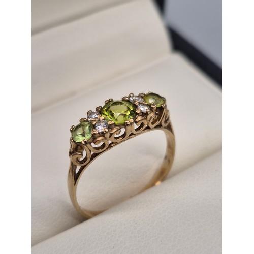 103 - 9ct yellow gold, Green Tourmaline and CZ gem stone ring. [Ring size N] [1.84Grams]