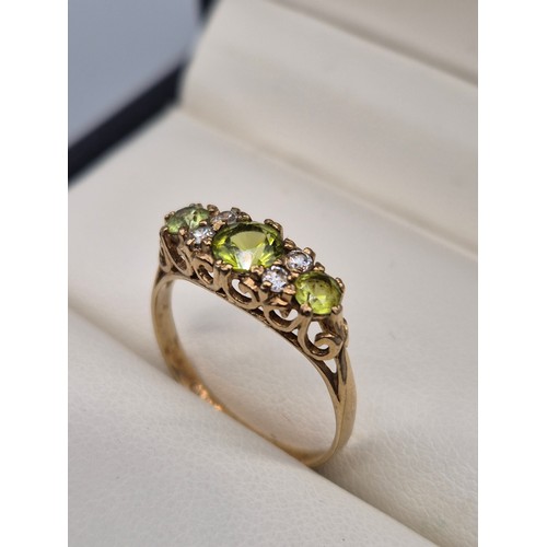 103 - 9ct yellow gold, Green Tourmaline and CZ gem stone ring. [Ring size N] [1.84Grams]