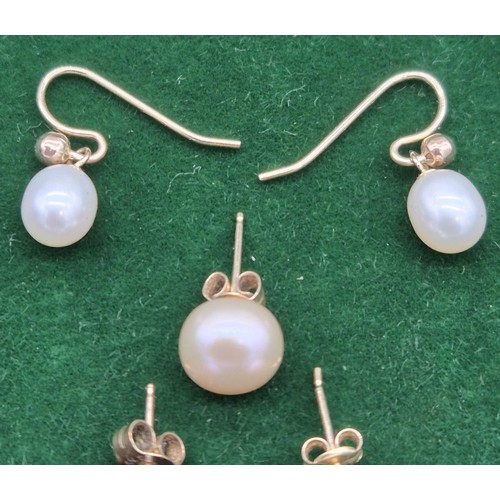 113 - Two pair of 9ct yellow gold and pearl earrings and one single earring.