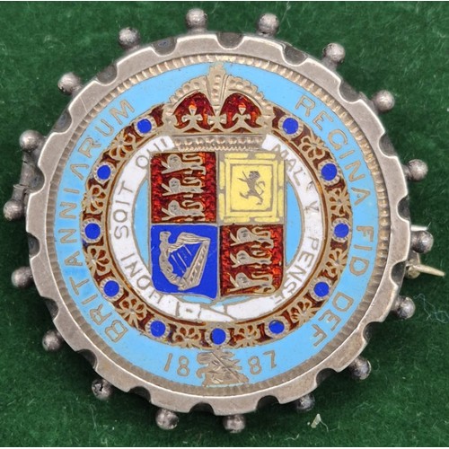 58 - 1887 Silver and enamel worked Queen Victoria coin brooch.