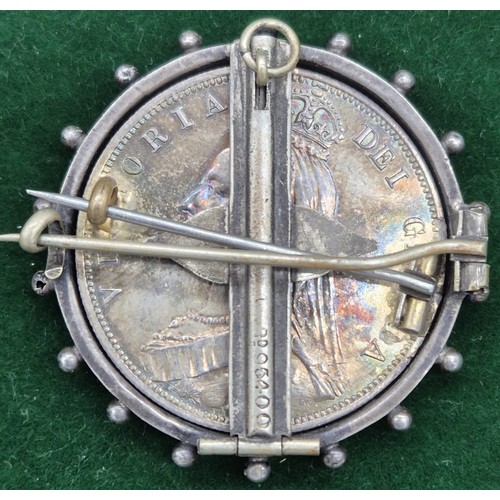 58 - 1887 Silver and enamel worked Queen Victoria coin brooch.