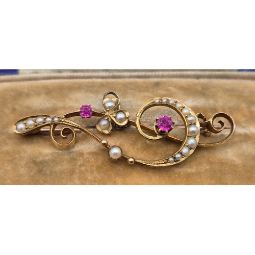 115 - 15ct yellow gold Edwardian bar brooch fitted with two ruby gem stones and seed pearls. Comes with bo... 