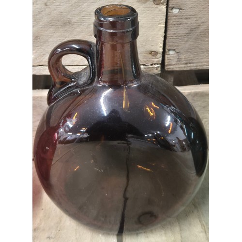 107 - A Collection of four antique and vintage glass flagon Decanters; Cranberry glass Decanter, Two Amber... 