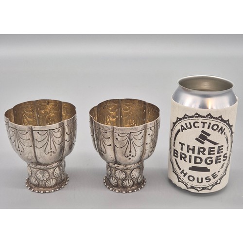 117 - A Pair of engraved Eastern Low Grade Silver Chalices [8.5cm High] [