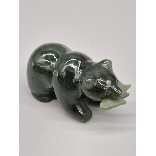 73 - Hand carved jade sculpture of a bear holding a fish in its mouth. [5cm length]