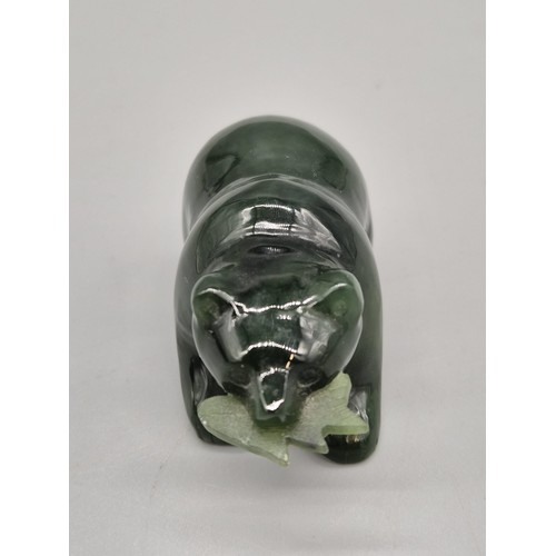 73 - Hand carved jade sculpture of a bear holding a fish in its mouth. [5cm length]