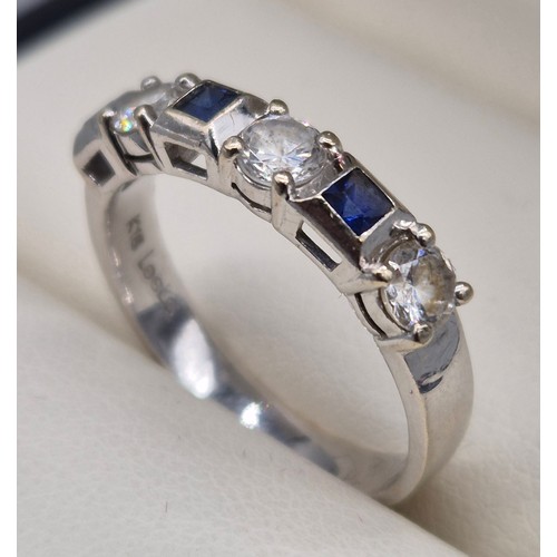 55 - 18ct white gold, sapphire and diamond stone ring. 0.60ct diamonds. Three Emerald cut sapphire gem st... 