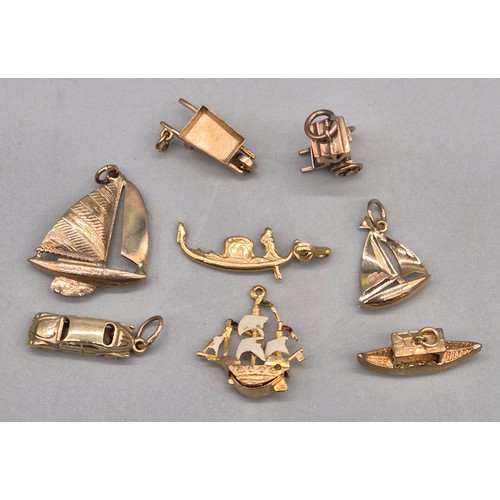 58 - A Collection of eight 9ct yellow gold charms. Sailing boats, Galleon, Rickshaw and car. 14.06grams.