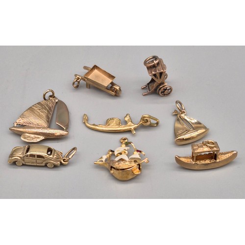 58 - A Collection of eight 9ct yellow gold charms. Sailing boats, Galleon, Rickshaw and car. 14.06grams.