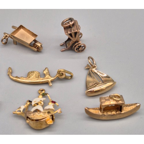 58 - A Collection of eight 9ct yellow gold charms. Sailing boats, Galleon, Rickshaw and car. 14.06grams.