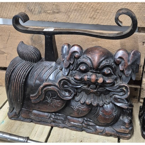 308 - A Pair of 19th century Chinese Rosewood and iron foo dog sculpture- possibly fire side dogs for comp... 