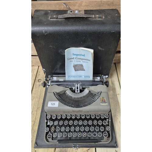 125 - Antique Imperial Model T Typewriter within a fitted travel case. Comes with booklet.