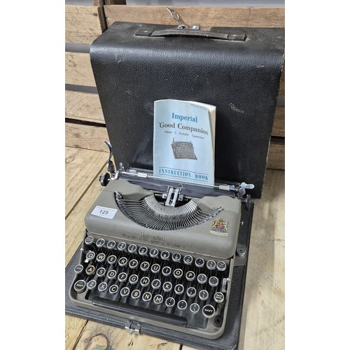 125 - Antique Imperial Model T Typewriter within a fitted travel case. Comes with booklet.