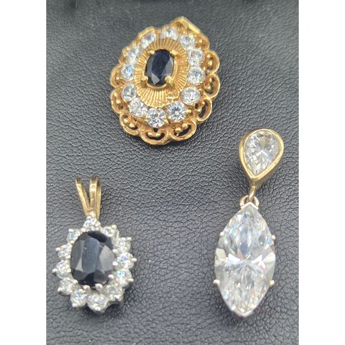 122 - Three various gold pendants with gem stones; 18ct yellow gold, Sapphire and CZ Stone pendant- 3.89gr... 