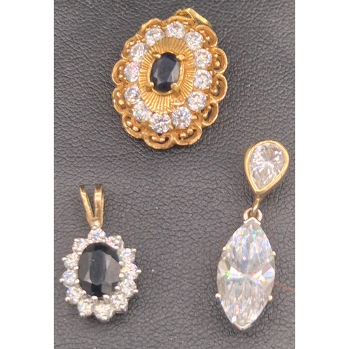 122 - Three various gold pendants with gem stones; 18ct yellow gold, Sapphire and CZ Stone pendant- 3.89gr... 