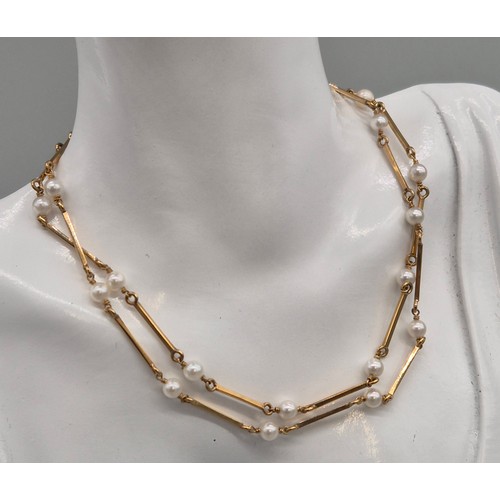 21 - 9ct yellow gold and pearl necklace. 59cm length. 11.75grams.