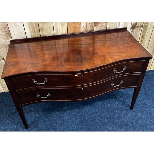 272 - 19th century Mahogany serpentine two drawer chest. Fitted with ornate bronze swing handles. Raised o... 