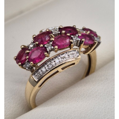13 - 9ct yellow gold, diamond and ruby stone ring. 2.68grams. Ring size M.