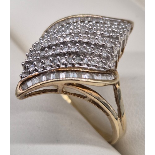 9 - 9ct yellow gold and diamond cluster ring. Fitted with six rows of round cut diamonds and two rows of... 
