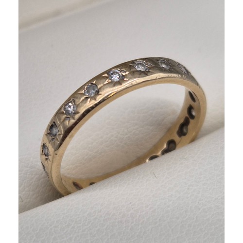 18 - 9ct yellow gold and diamond stone band ring. 2grams. Ring size N 1/2.