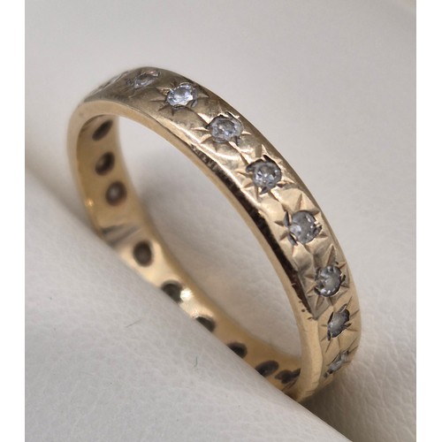 18 - 9ct yellow gold and diamond stone band ring. 2grams. Ring size N 1/2.