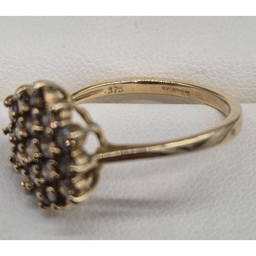 22 - 9ct yellow gold and diamond cluster ring. 0.90cts diamonds. 2.64Grams. Ring size P.