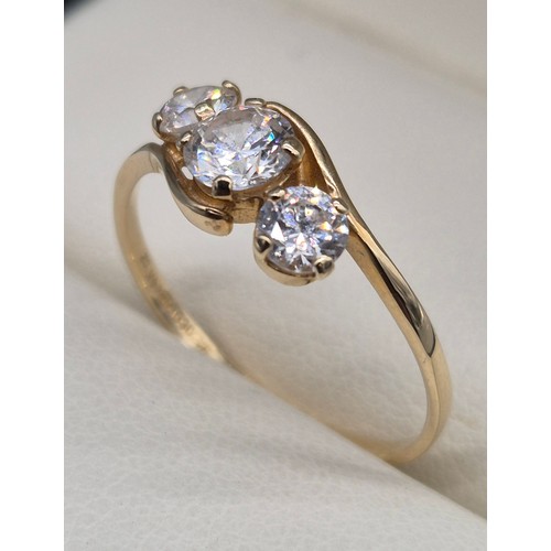 26 - 14ct yellow gold and CZ Stone ring. Three round cut CZ Stones. 1.76grams. Ring size Q.
