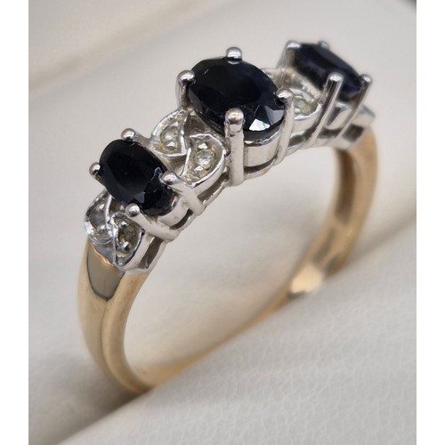 25 - 9ct yellow gold Sapphire and Diamond stone ring. Three oval cut sapphires and eight small round cut ... 